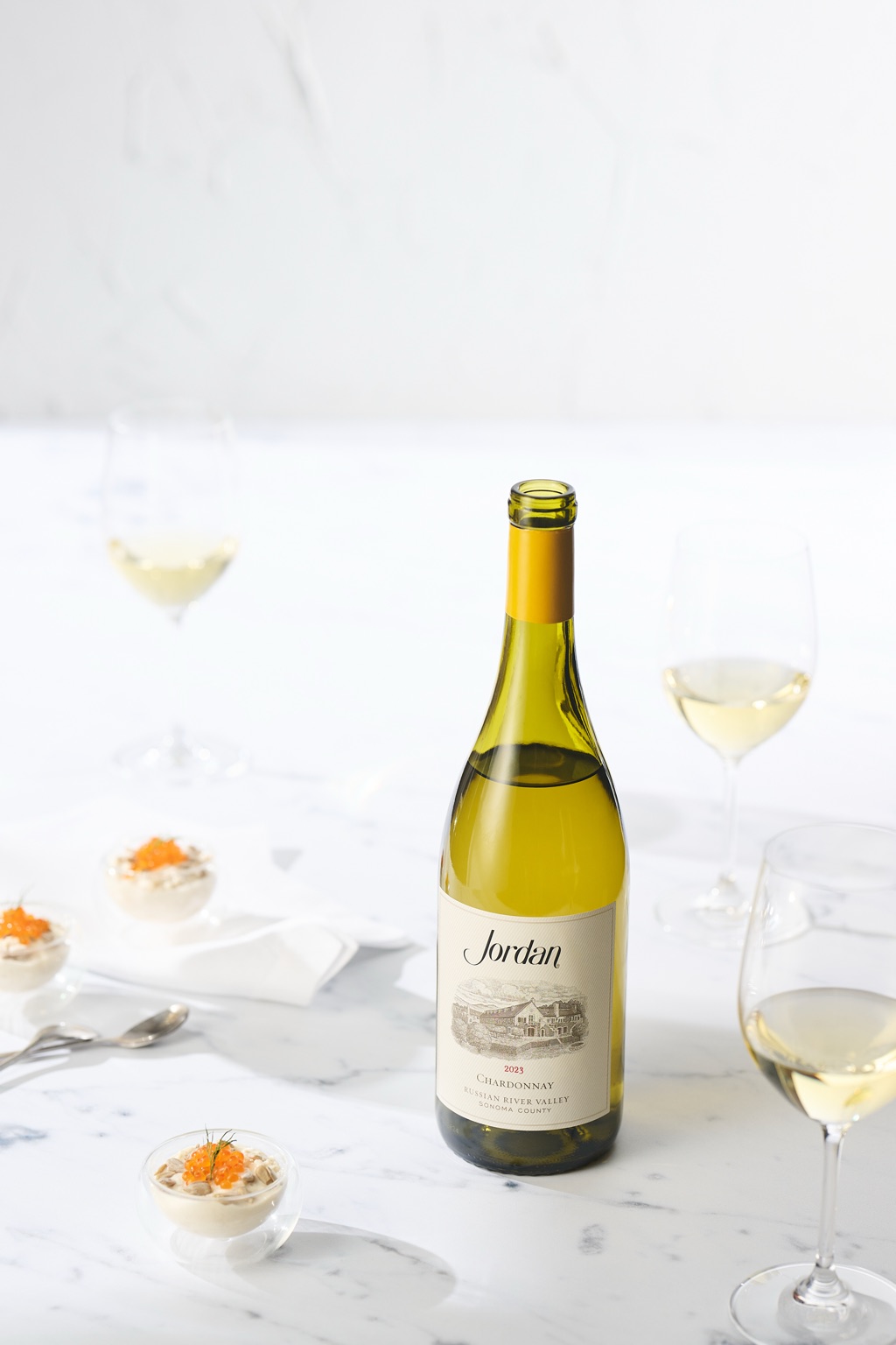 Jordan chardonnay still life on marble with caviar appetizers and coupes at the Alexander Valley winery
