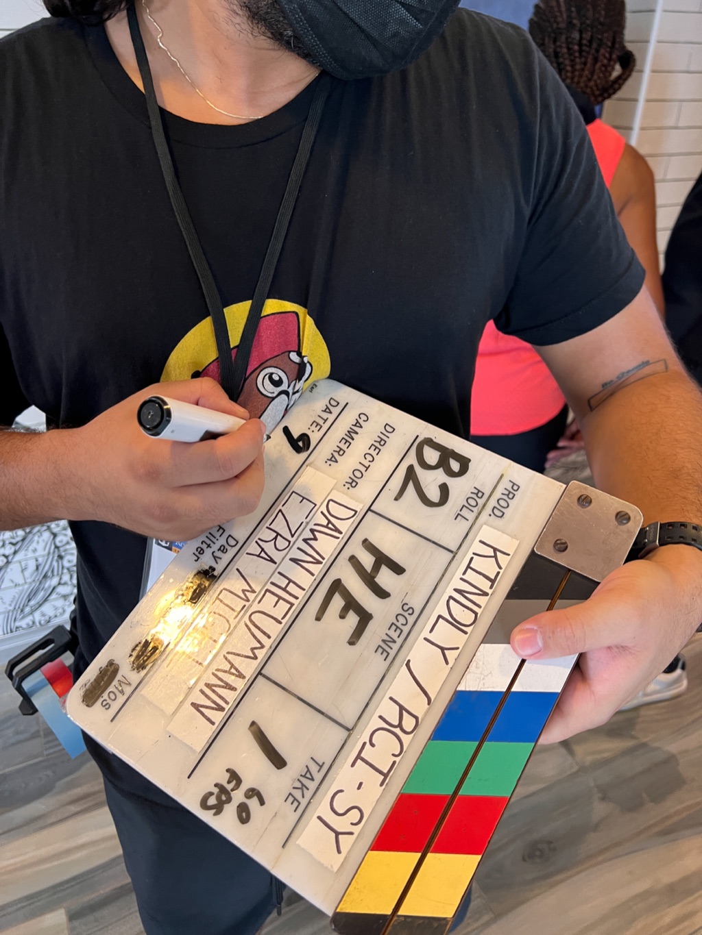 Clapperboard listing Dawn Heumann as director moments before a take, photographed by Dawn Heumann