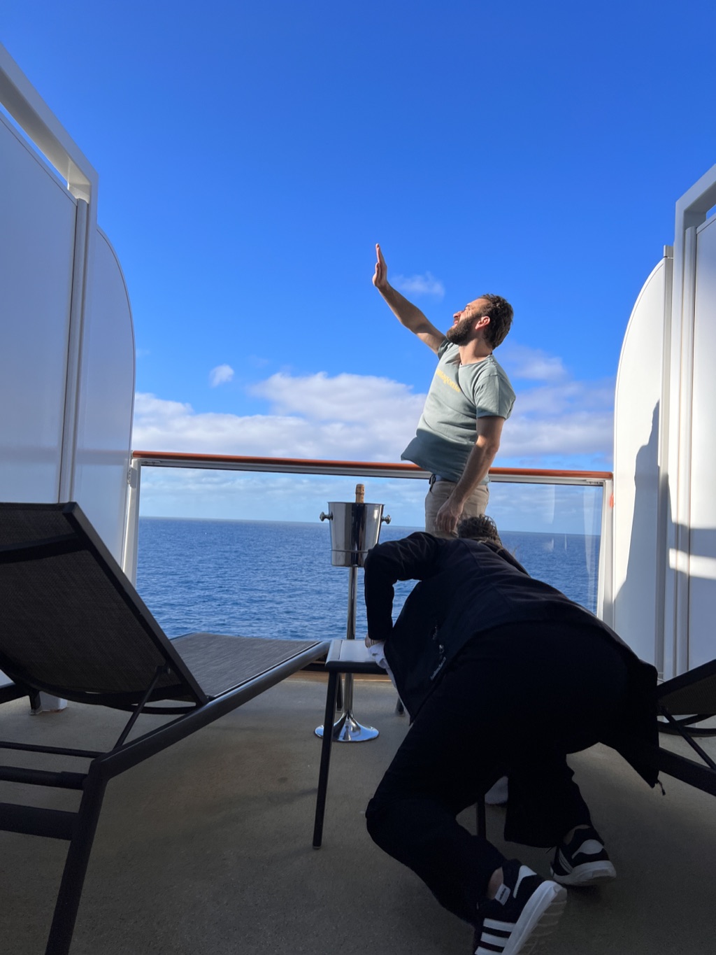 Blocking a scene on a ship balcony with crew crouched just out of frame