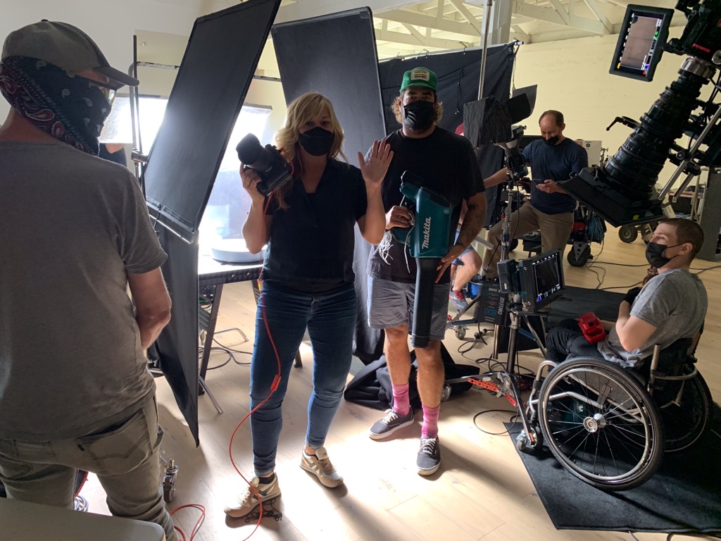 Dawn Heumann and crew improvising wind with a leaf blower between takes in the studio