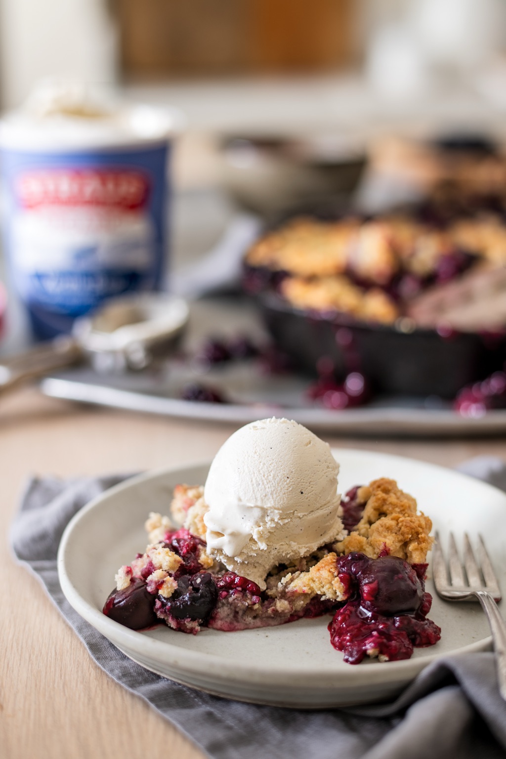 Straus Family Creamery vanilla ice cream melting over a warm berry cobbler