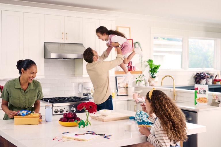 Family breakfast in a bright kitchen photographed by Dawn Heumann