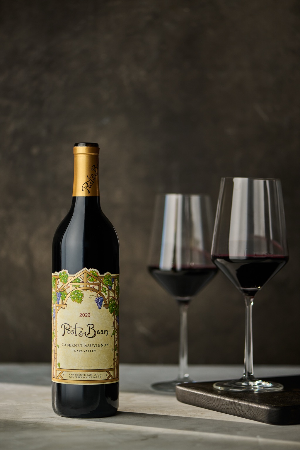 Post and Beam Napa Valley cabernet sauvignon still life with two glasses of red on stone
