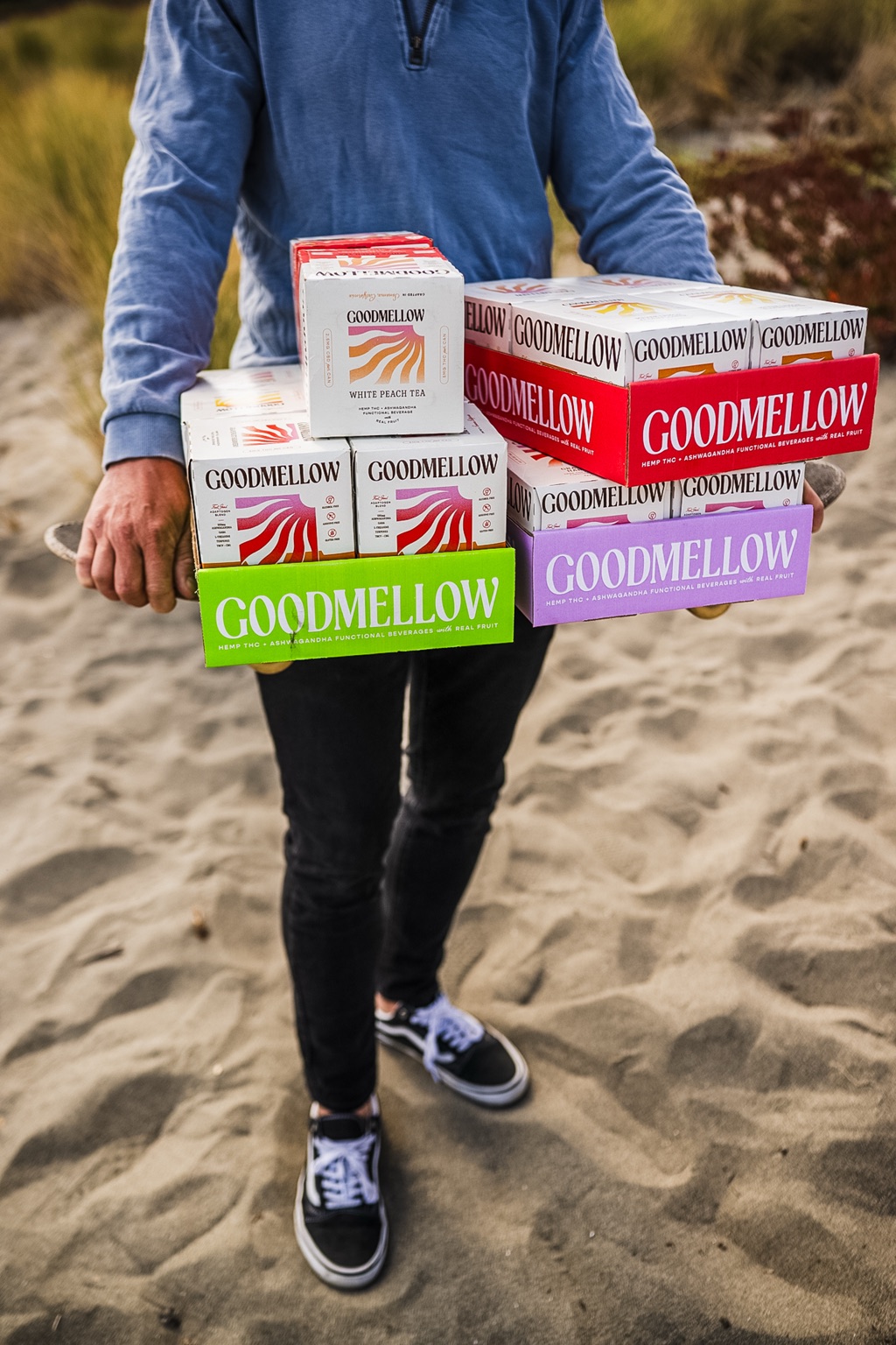 Carrying cases of Goodmellow down to the beach