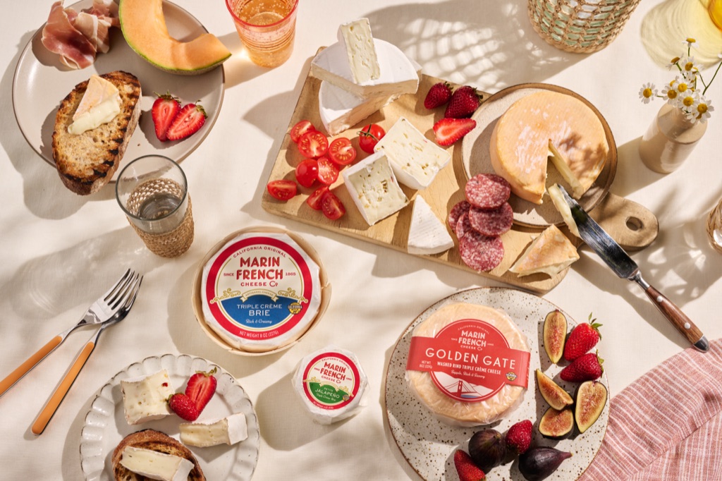 Overhead spread of Marin French Cheese with their Golden Gate brie and fresh strawberries, photographed by Dawn Heumann