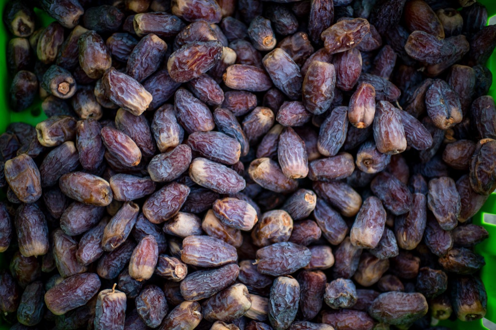 Overhead bin of freshly harvested medjool dates