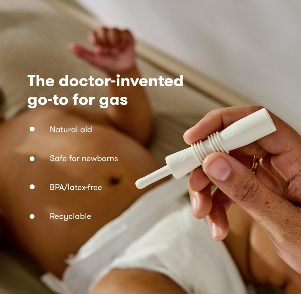 Frida Baby Windi gas reliever digital ad held above a baby on a changing pad