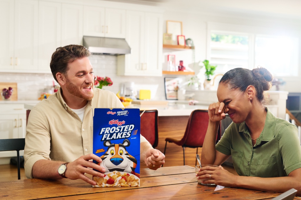 Parents cracking up at the breakfast table with a box of Frosted Flakes, Kellogg's campaign photography by Dawn Heumann