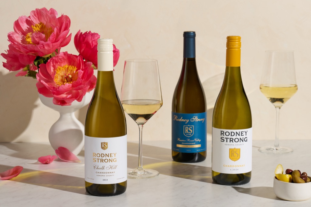Three Rodney Strong chardonnays, Chalk Hill, Russian River Valley, and Sonoma County, styled with peonies and olives