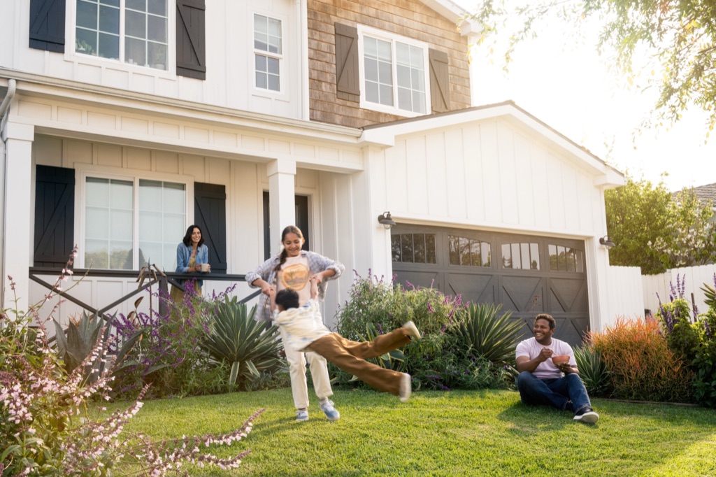 Family playing in the front yard at golden hour, Silk campaign photography by Dawn Heumann, photographed by Dawn Heumann