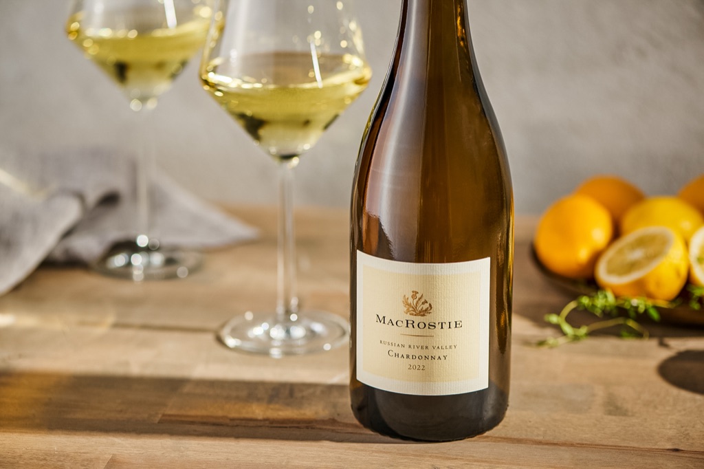 MacRostie Russian River Valley chardonnay with two glasses and a bowl of Meyer lemons