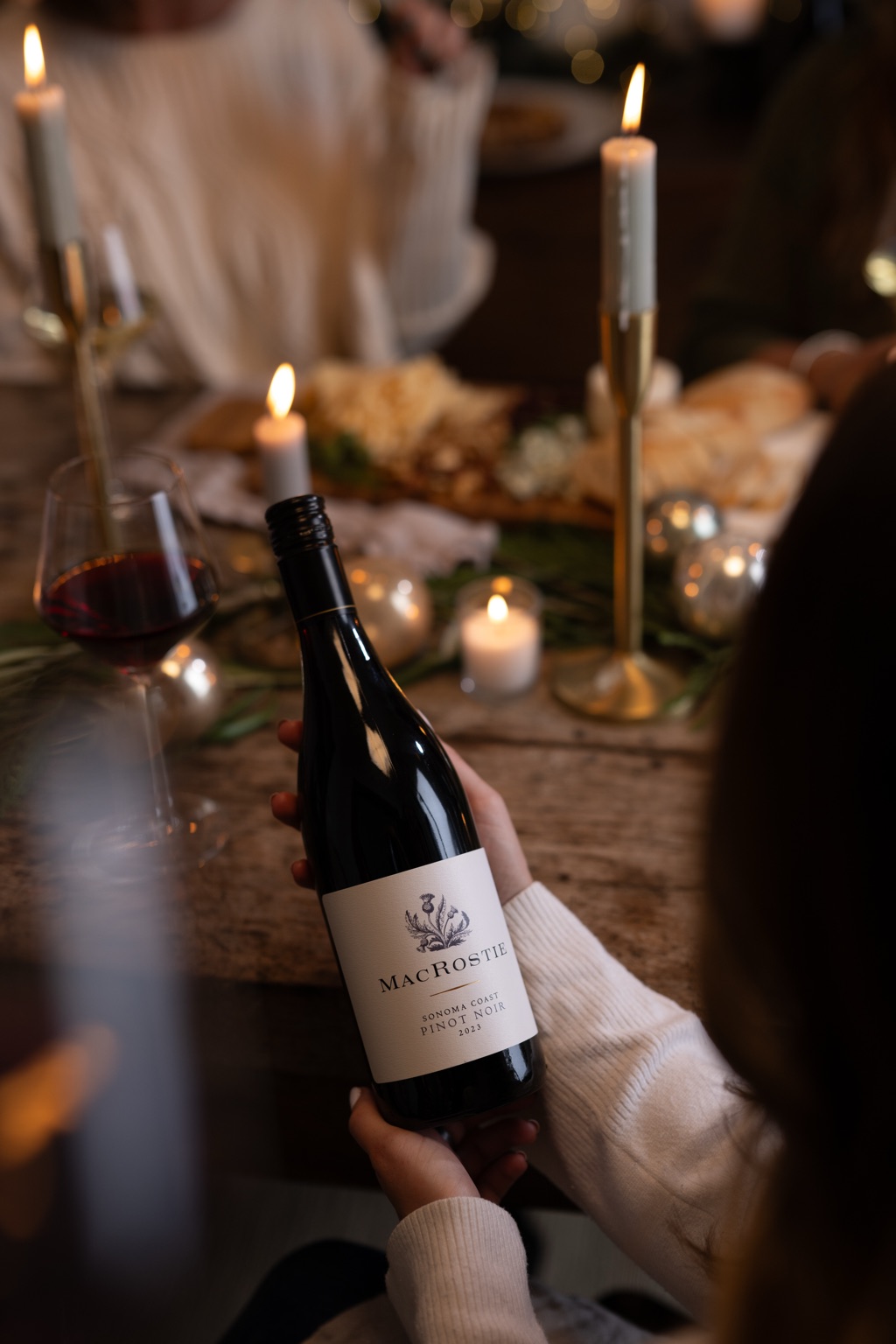 MacRostie Sonoma Coast pinot noir passed across a candlelit holiday table