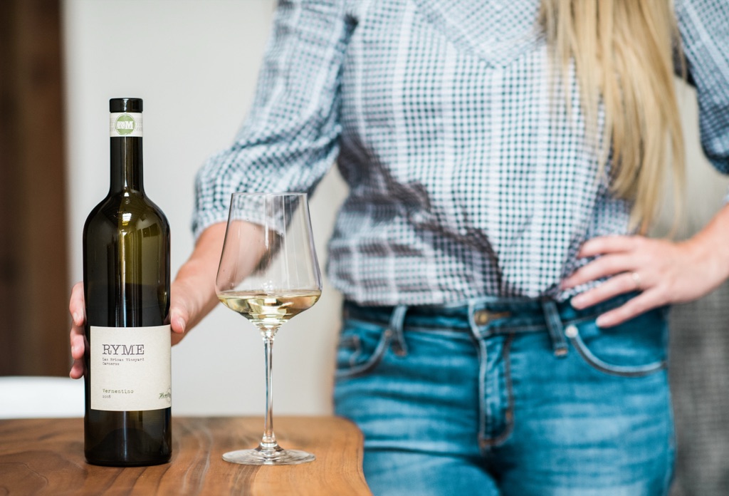 Ryme Cellars Las Brisas Vineyard vermentino with a poured glass on a walnut counter