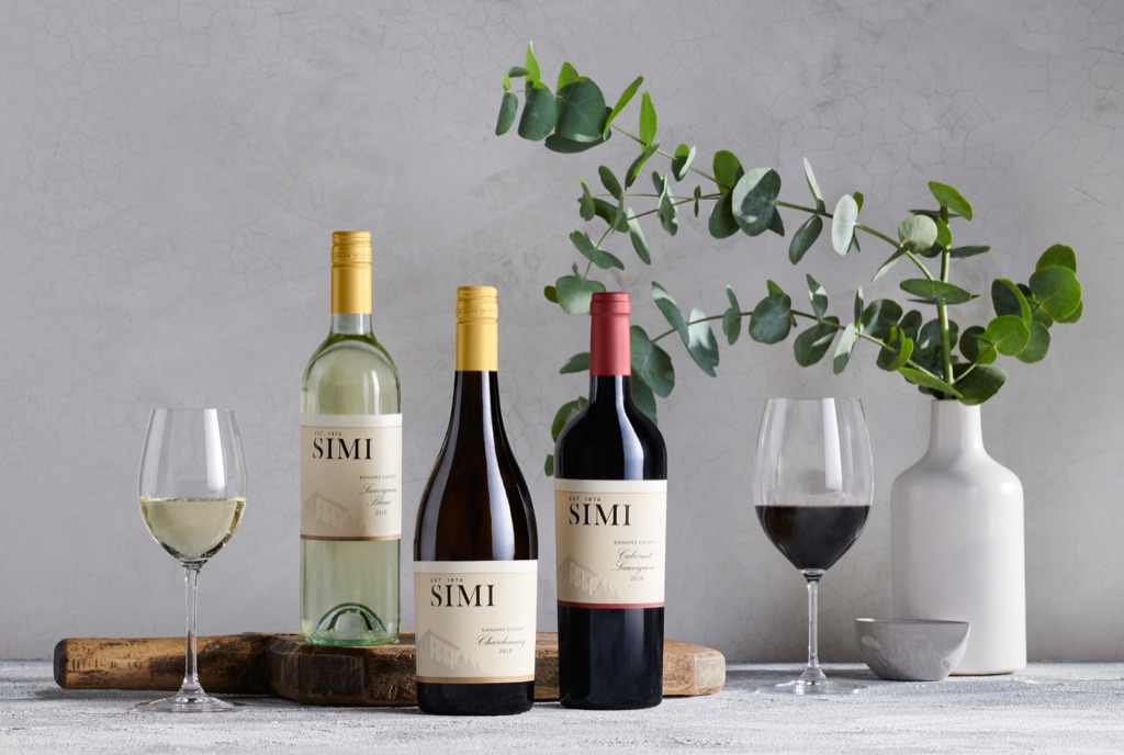 SIMI sauvignon blanc, chardonnay and cabernet still life with eucalyptus on a plaster backdrop