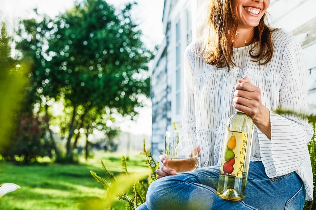 Pomelo wine poured in the garden at golden hour