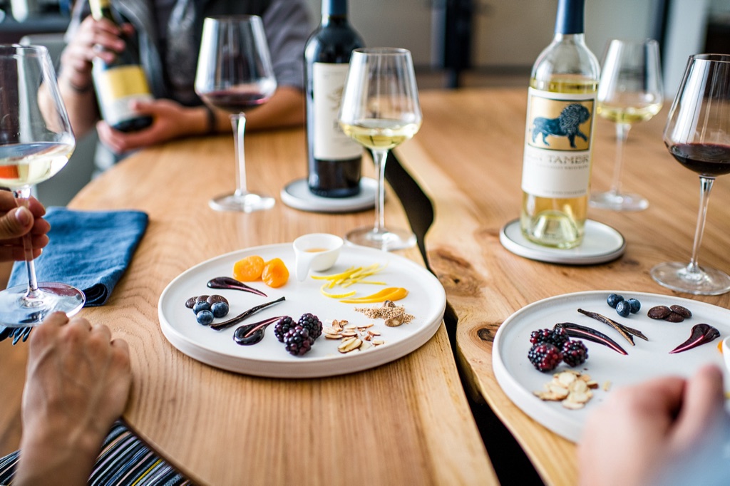 Wine and food pairing plates of fruit, chocolate, and spice at a guided tasting